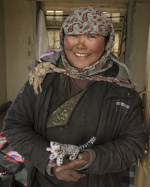 woman and snow leopard toy